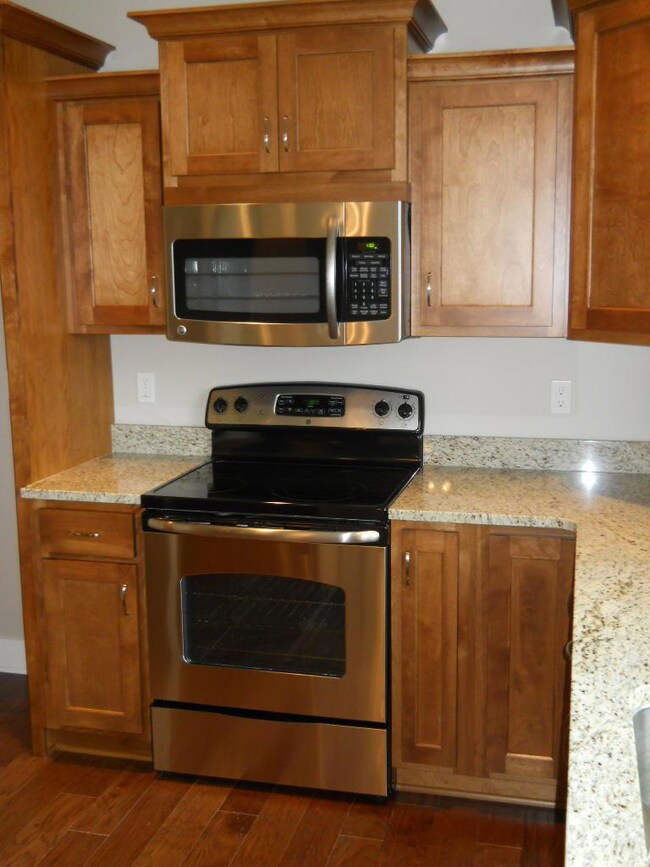 Stainless/black stove with microwave