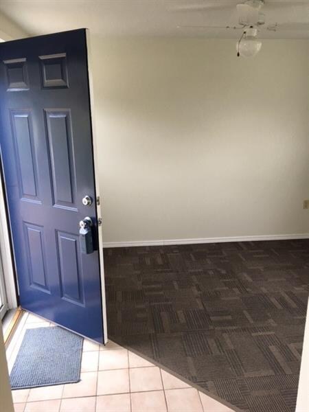 Ceramic entry with large coat closet.