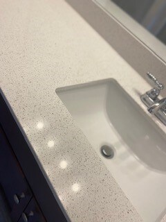 White Quartz in bathrooms upstairs