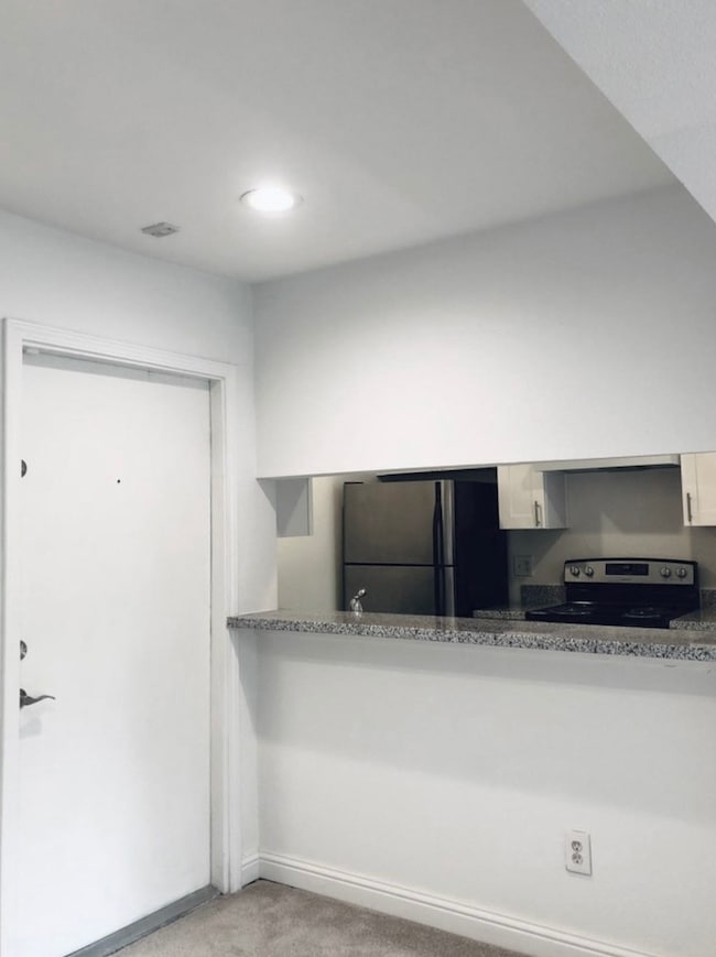 Front door to this charming condo. On the left a p