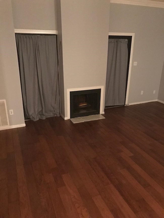 Unfurnished living room featuring a fireplace with