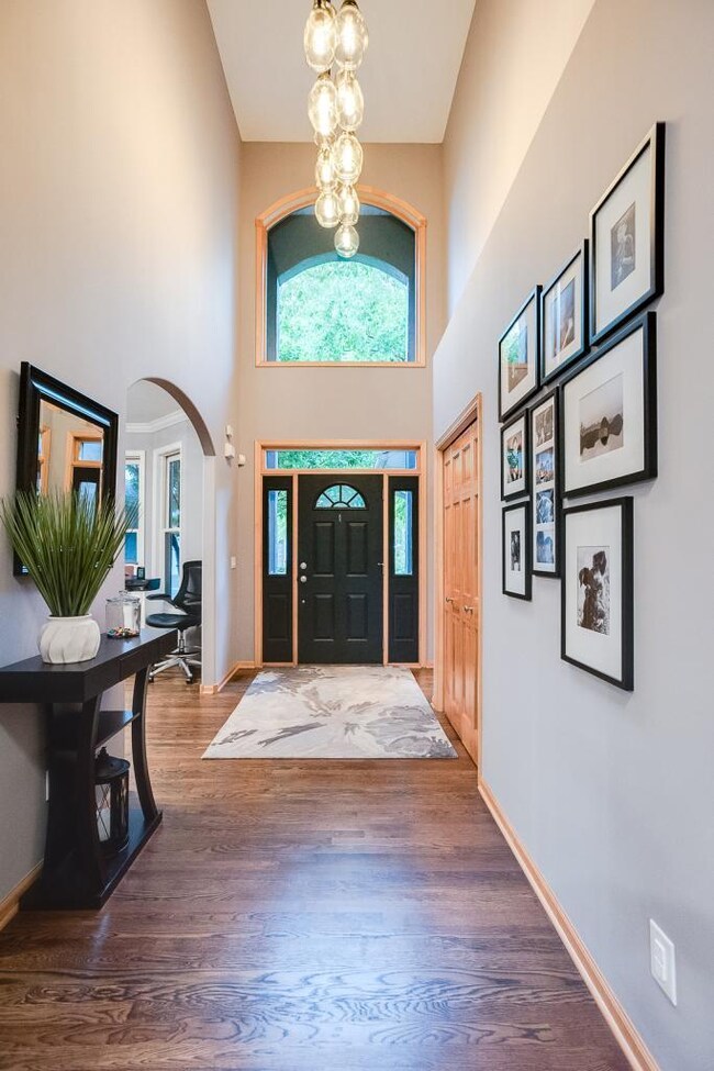 Two story entry with unique chandelier.