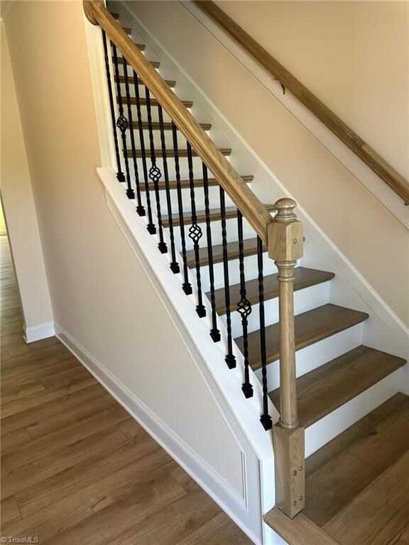 Hardwood stairs & iron rails