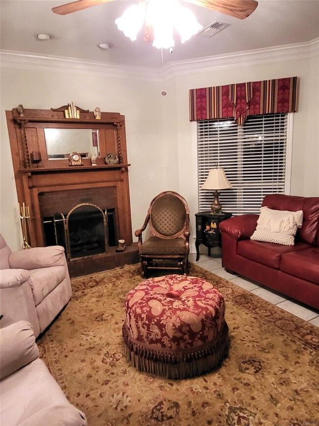 Gathering room with tile flooring. Propane logs, g