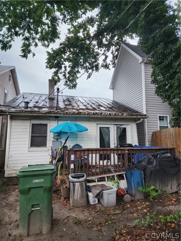 Back of property with a deck