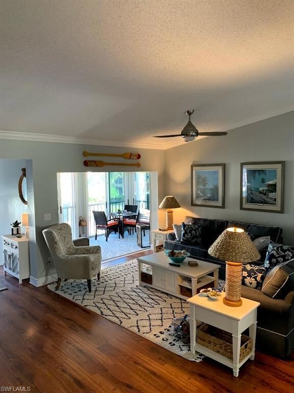 Living room with ceiling fan, hardwood / wood-styl