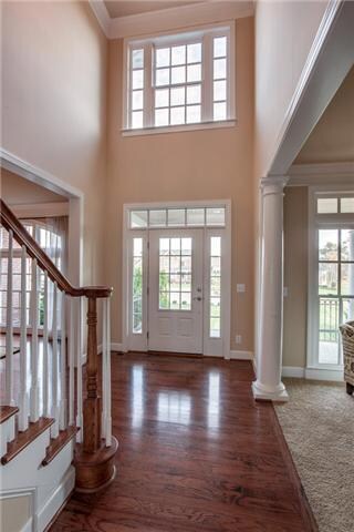 Spacious and inviting entry with hardwood flooring......