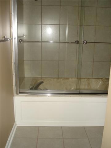 Master Bathroom Jacuzzi Tub is completely tiled & has new shower doors.