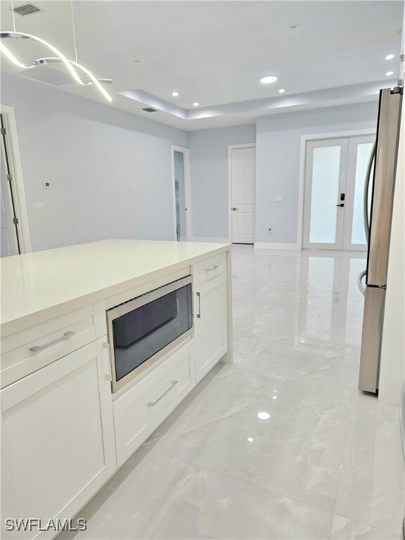Kitchen with appliances with stainless steel finis