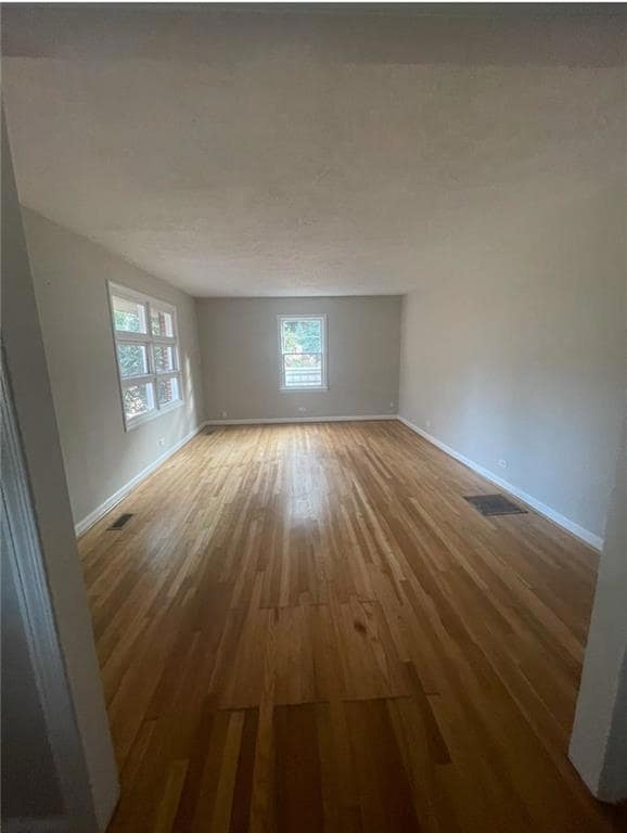 Empty room with wood-type flooring