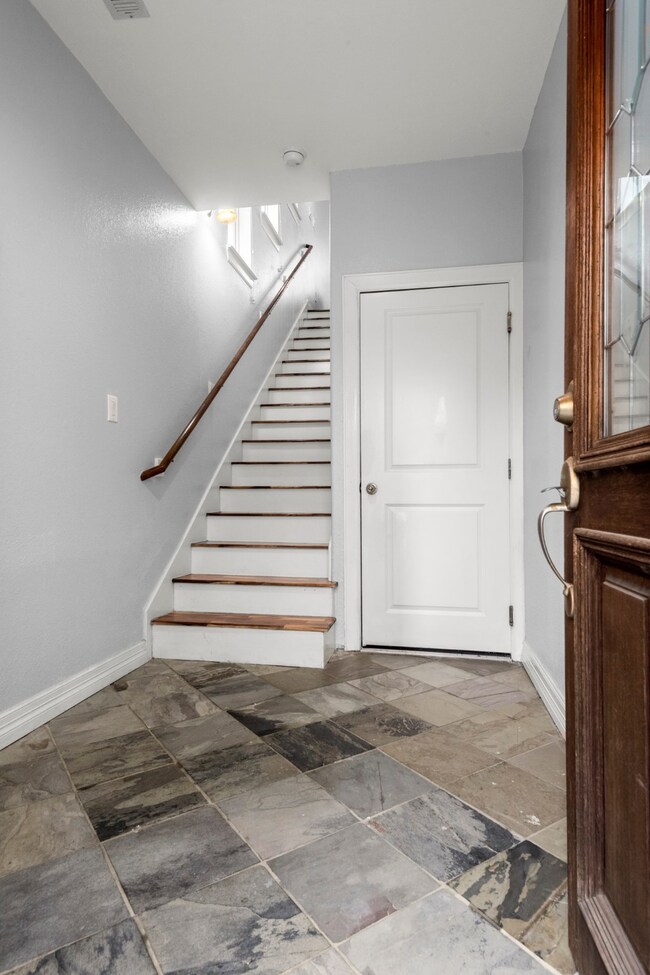 Front entry with slate flooring.