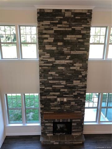 Amazing floor to ceiling stone fireplace w/ cedar mantle!