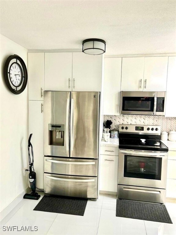 Kitchen featuring stainless steel appliances, ligh