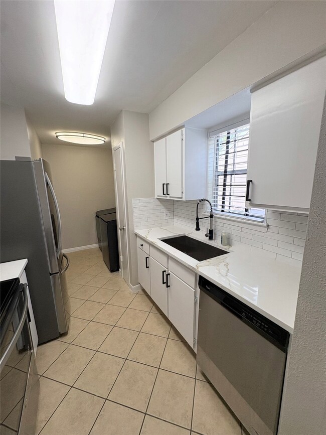 Updated kitchen with New Countertops, Sink and Garbage Disposal