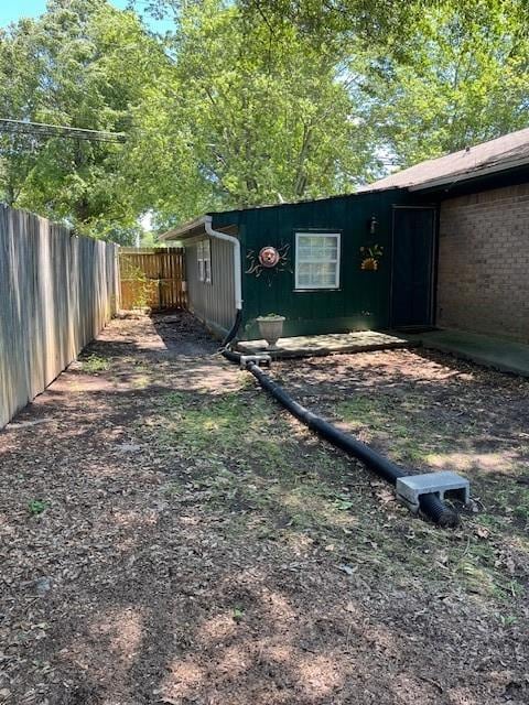 View of fenced backyard