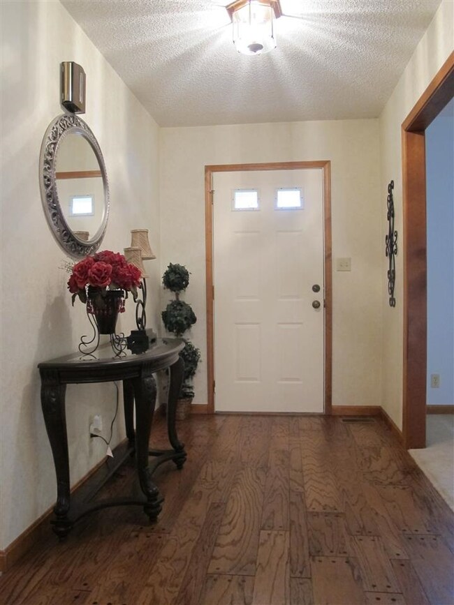 Entry foyer is open to the formal living and dinin
