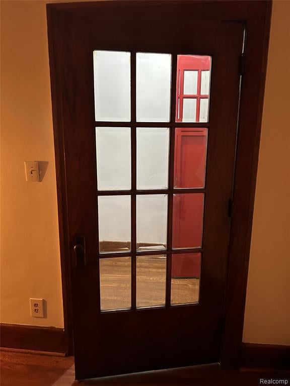 Detailed view of baseboards and wood finished floors