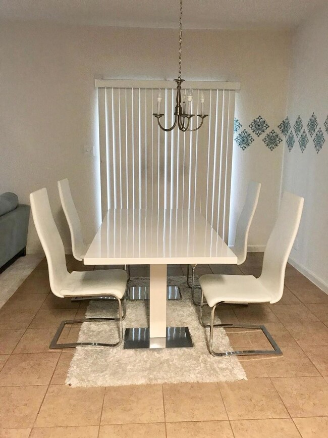 Dining space featuring tile patterned flooring an