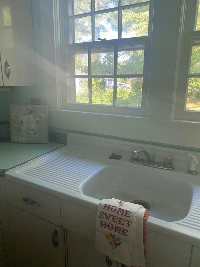 Look at that original sink and cabinet!!! 