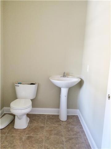 Half bath conveniently located on main level for guests. 