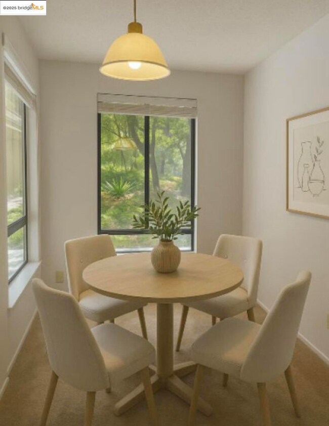 Dining room with healthy amount of natural light and carpet floors