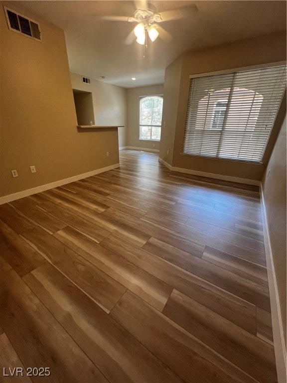 Empty room with wood finished floors and a ceiling