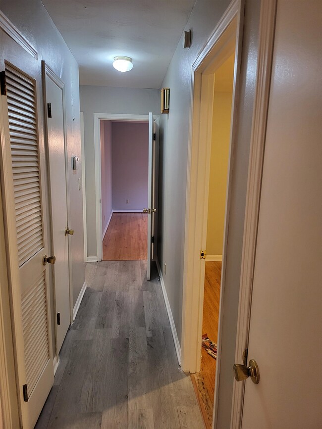 Corridor featuring hardwood / wood-style floors