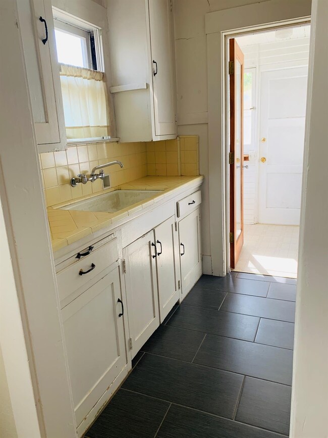 Recently installed new tile on kitchen floor. Kitc