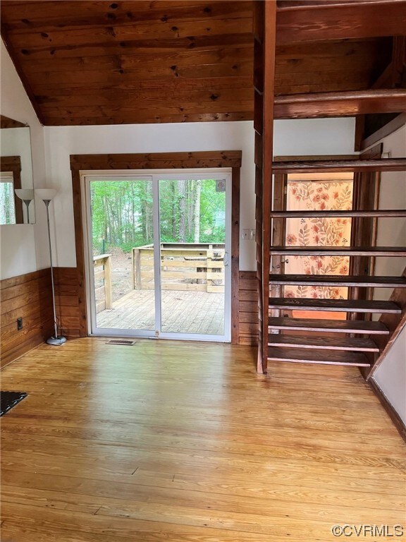 Empty room with hardwood flooring and natural ligh
