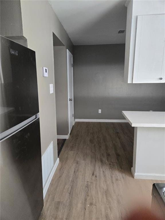 Kitchen featuring freestanding refrigerator, visib