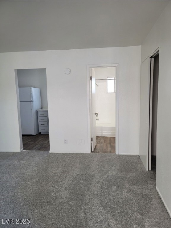 Unfurnished room with carpet flooring