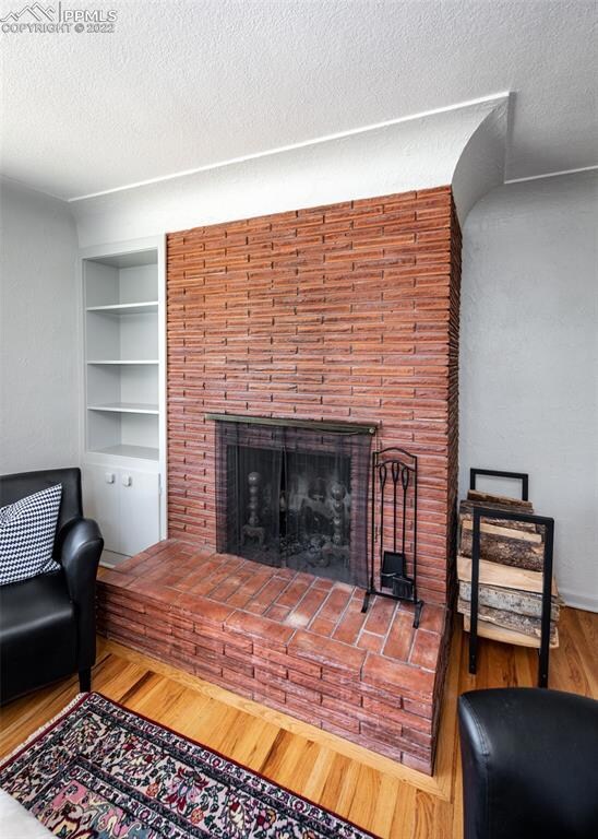 One of two wood-burning fireplaces