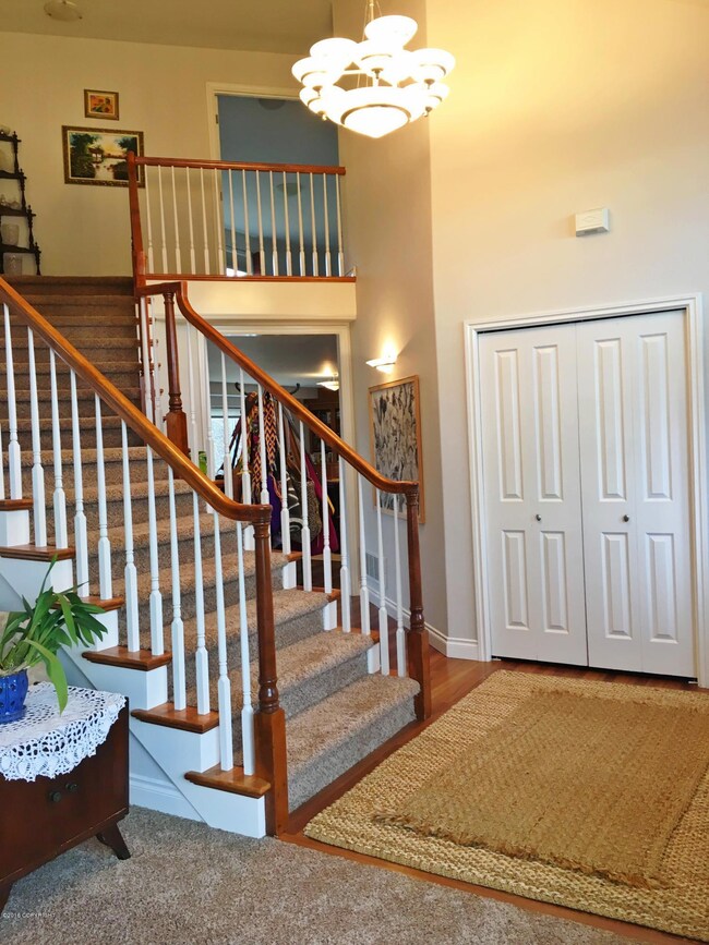 Spacious foyer with coat closet
