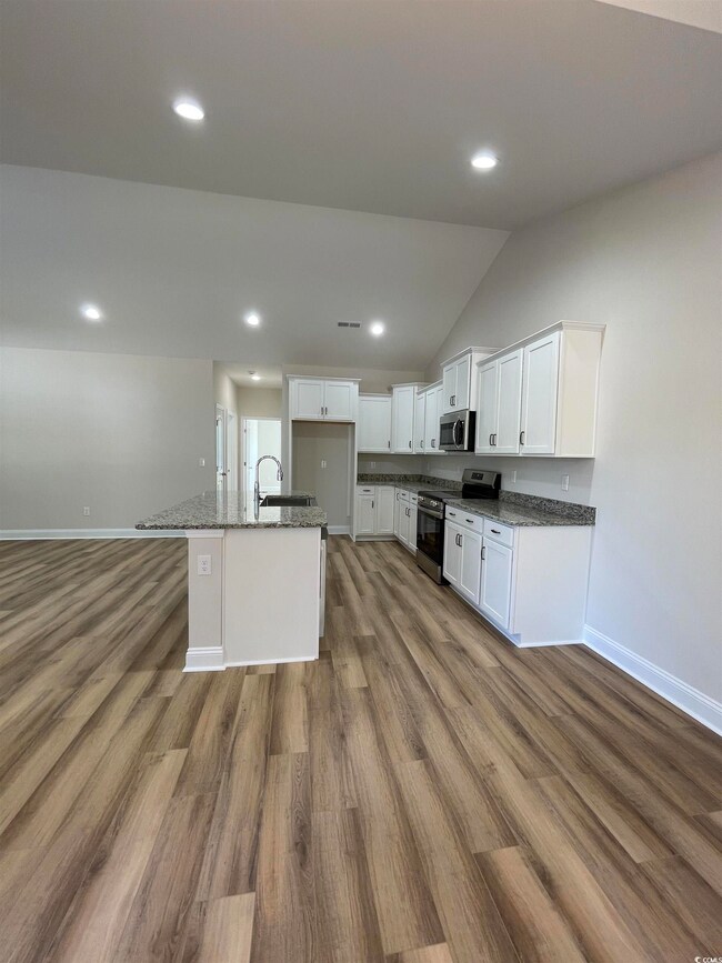 Kitchen with appliances with stainless steel finis