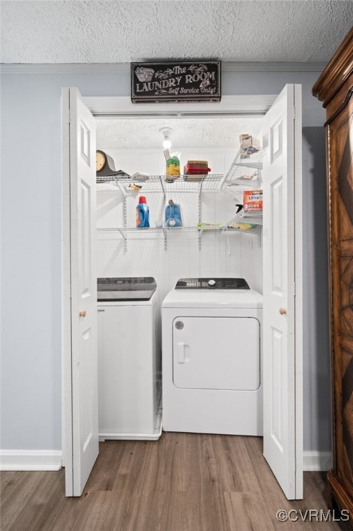 Laundry area with washing machine and dryer, wood