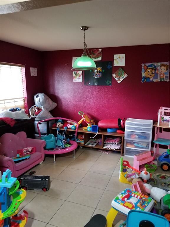 room made as 5th bedroom as you walk in on the lef