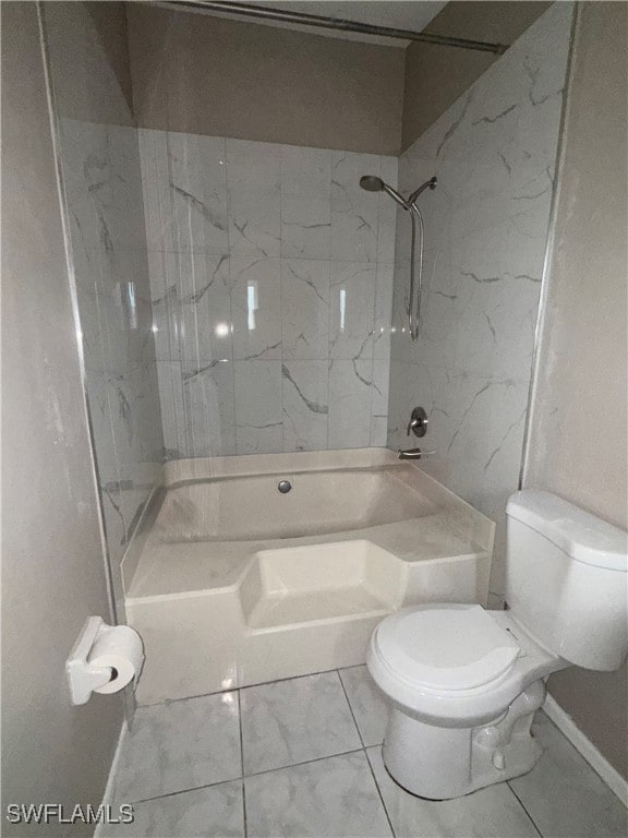 Full bathroom with marble look tiles and shower /