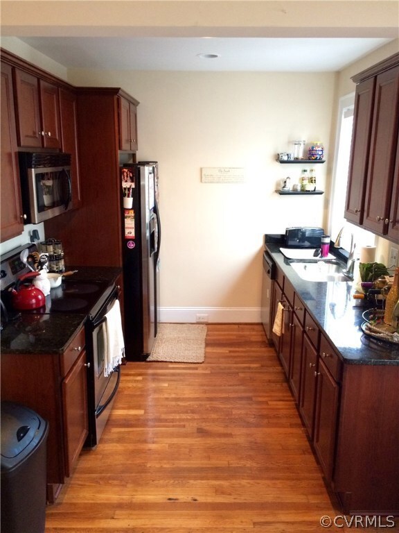 Kitchen with maple cabinets and granite tops