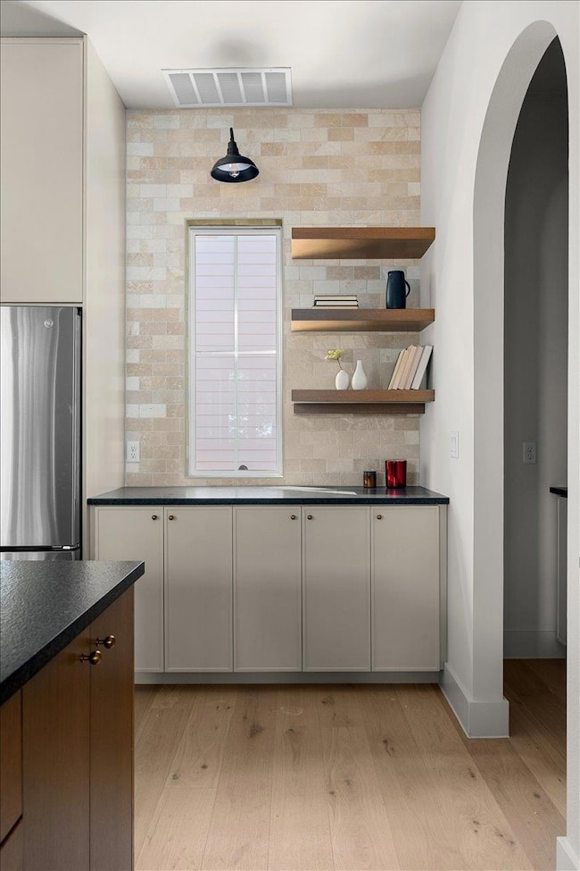 Kitchen featuring light wood-style flooring, free