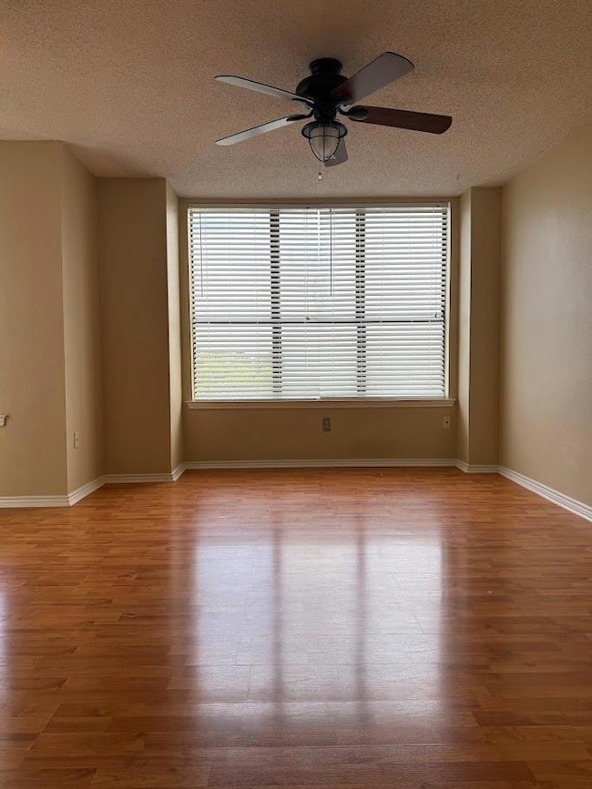 Unfurnished room featuring wood finished floors, 