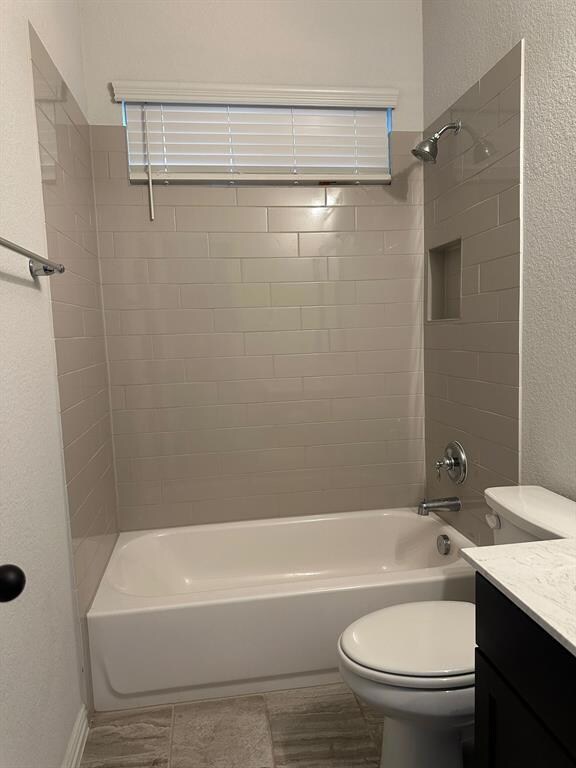 Full bathroom with vanity, shower / tub combinati
