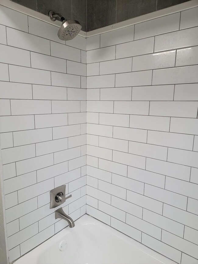 New subway tile and brushed nickel faucet/shower head!