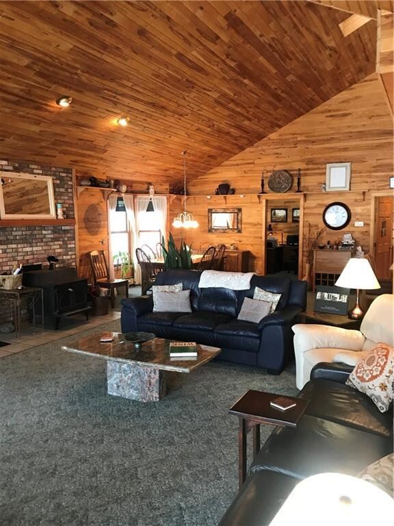 Spacious great room beneath soaring birch ceilings