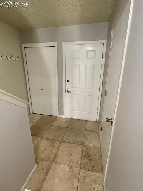 entryway with travertine tile