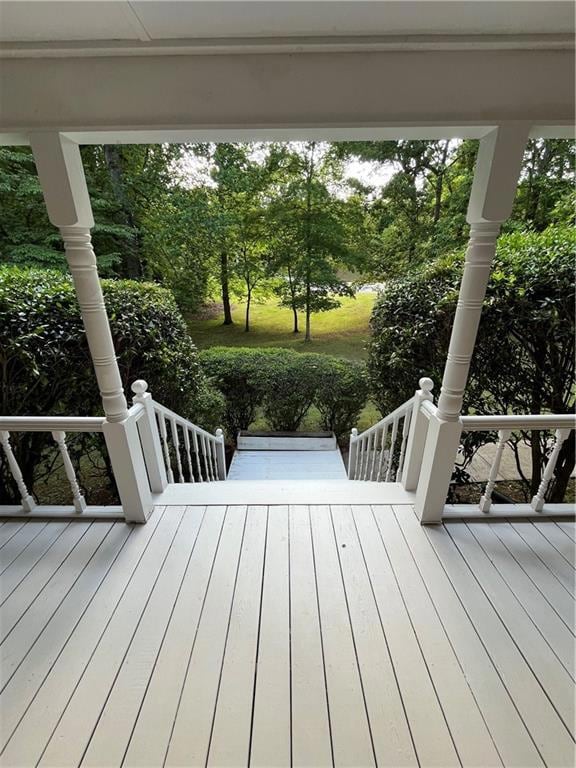 Wooden terrace with a porch and view of scattered 