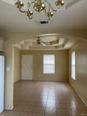 Empty room featuring a chandelier