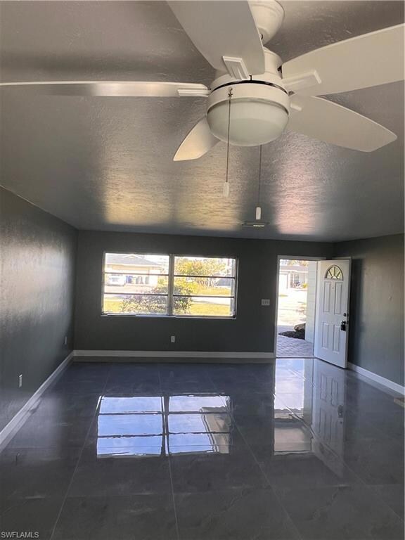 Unfurnished room with ceiling fan