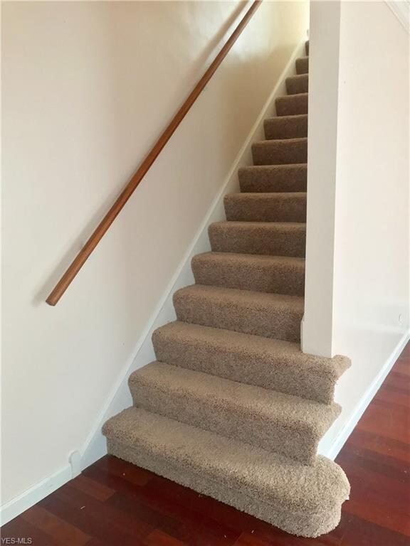 Newer carpet on stairs leading to second floor.