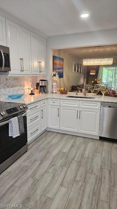 Kitchen with a sink, tasteful backsplash, stainles