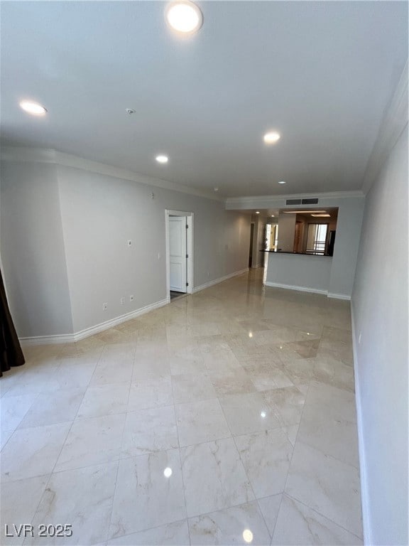 Spare room with crown molding, recessed lighting,